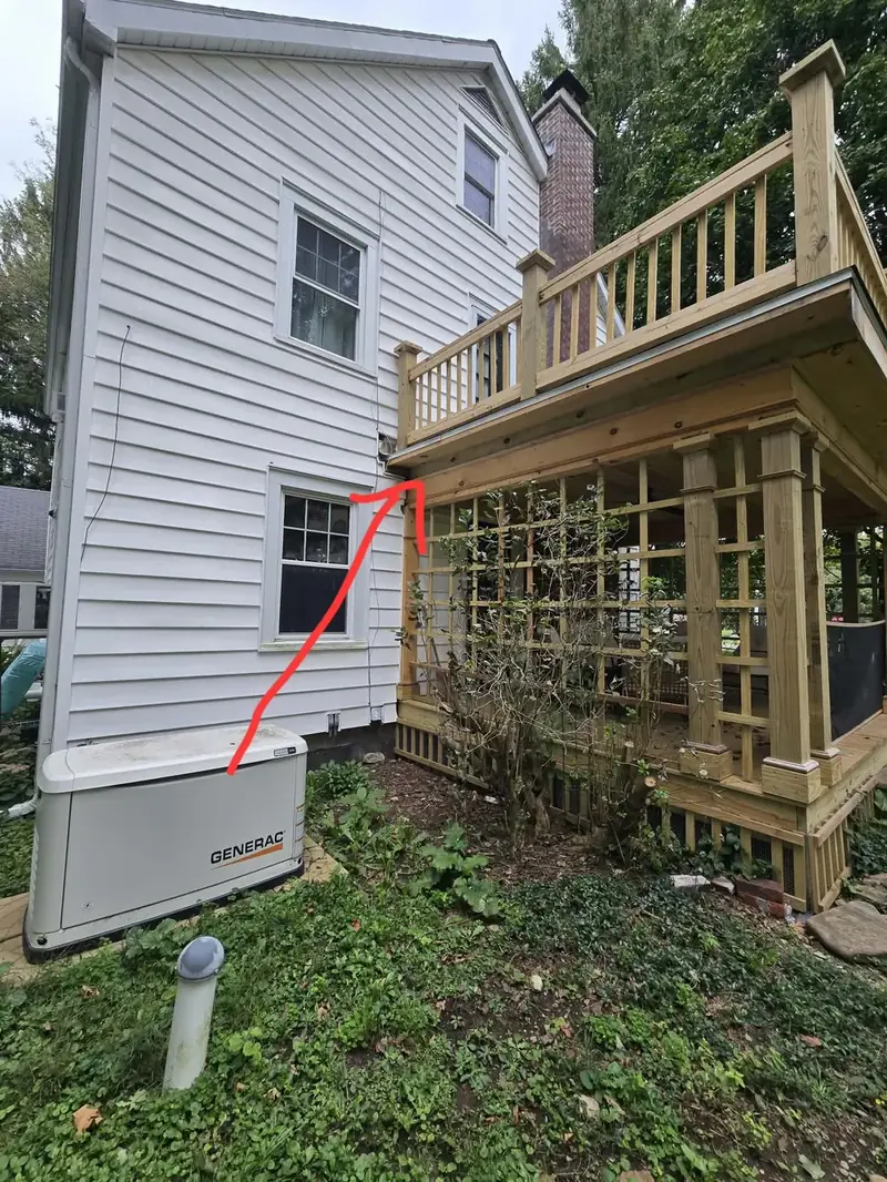 House exterior with a pest entry point marked during an inspection